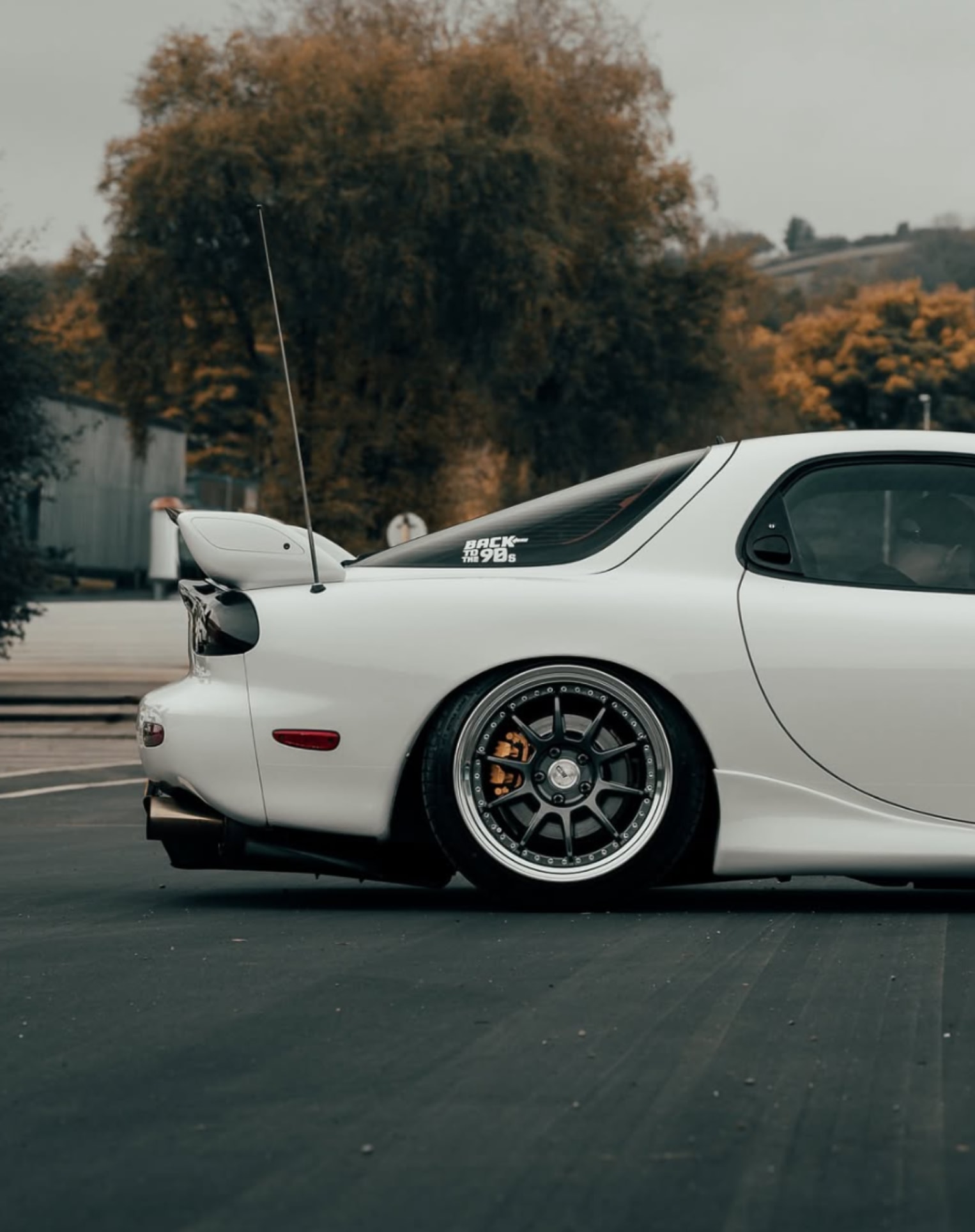 Outdoor rear quarter detail of the RX-7 wheel and side profile